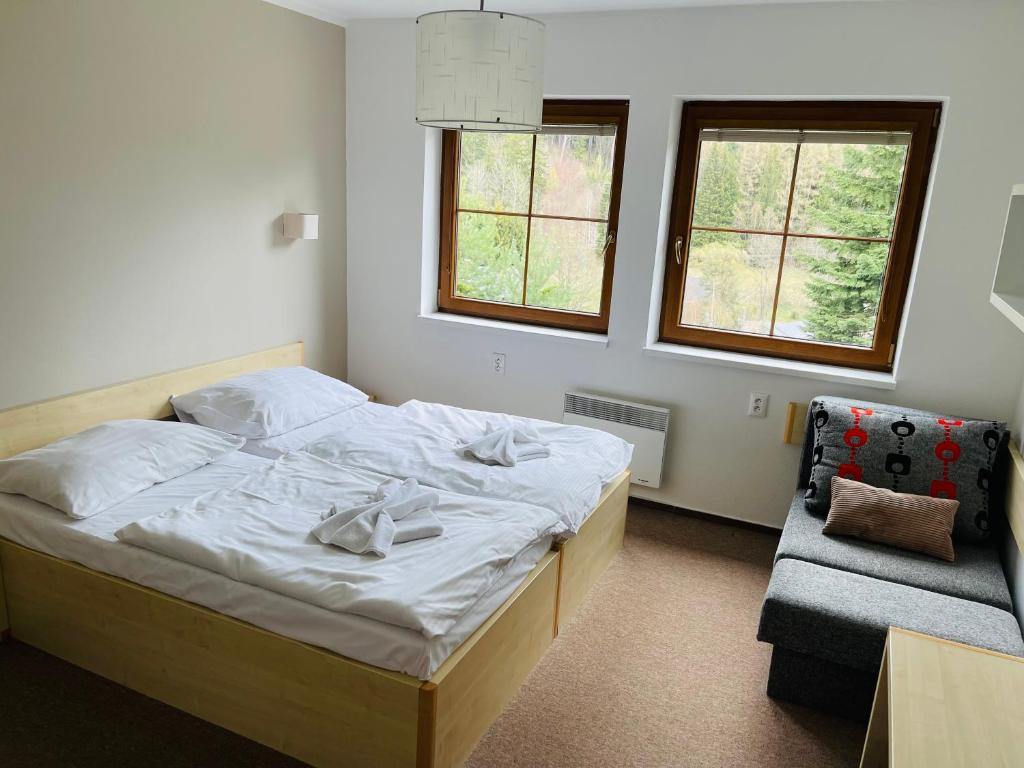 Postel nebo postele na pokoji v ubytování Horský hotel Brans