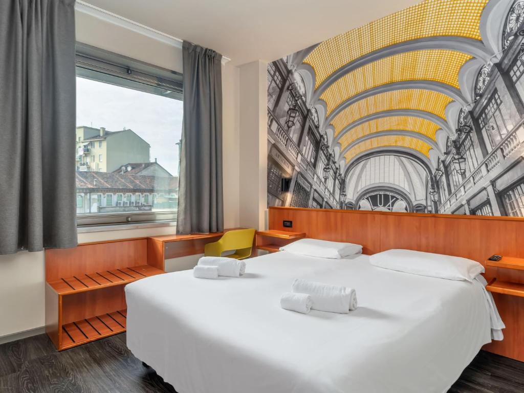 Postel nebo postele na pokoji v ubytování B&B Hotel Torino President