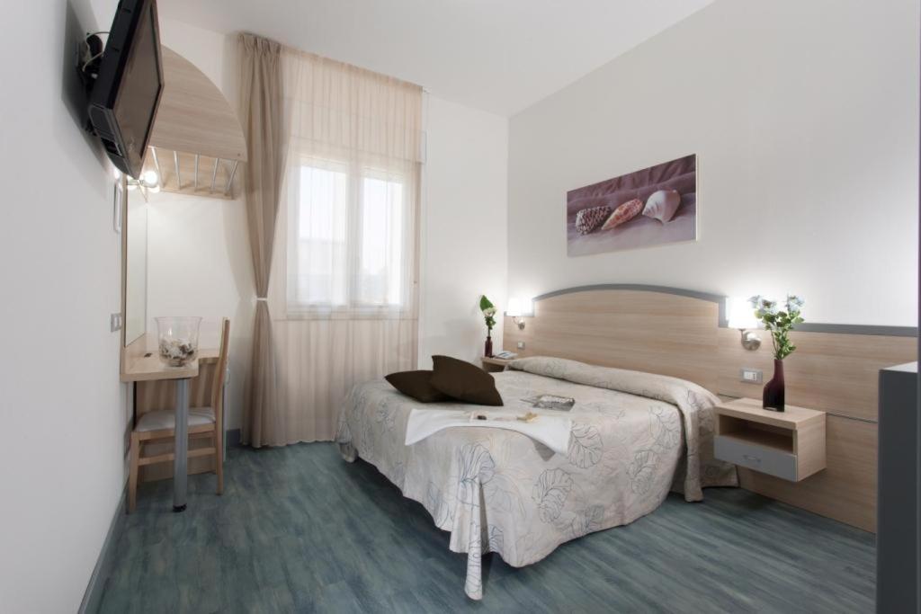 Postel nebo postele na pokoji v ubytování Hotel Beau Soleil