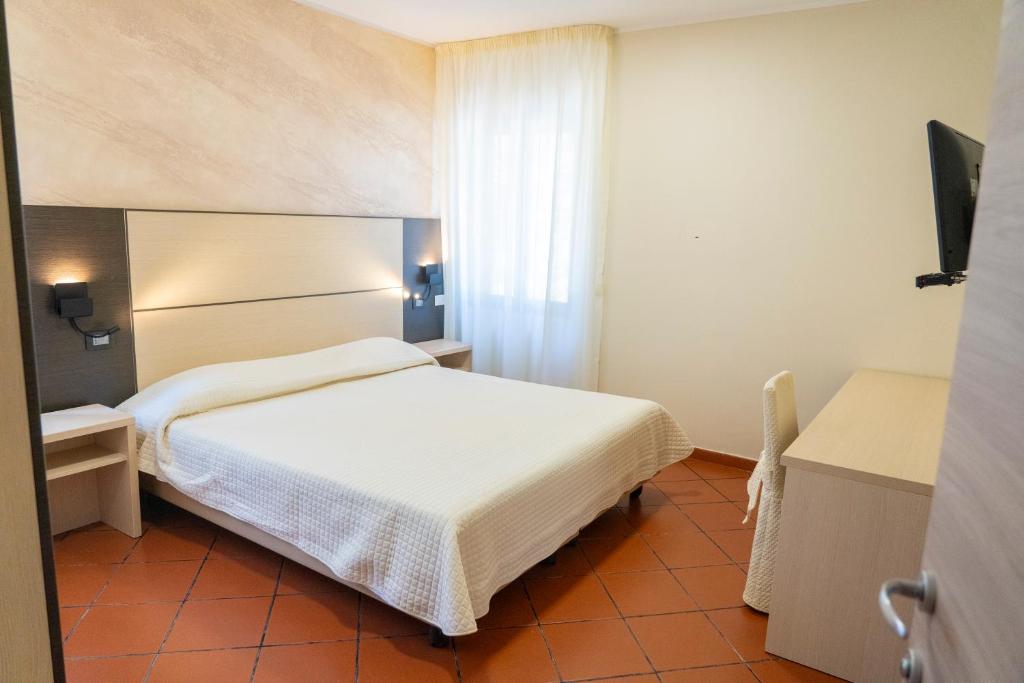 Postel nebo postele na pokoji v ubytování Albergo della Posta