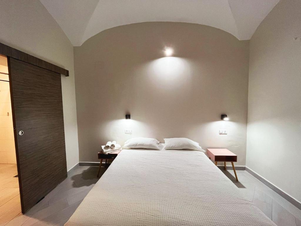 Postel nebo postele na pokoji v ubytování Hostal Pompeya Merida