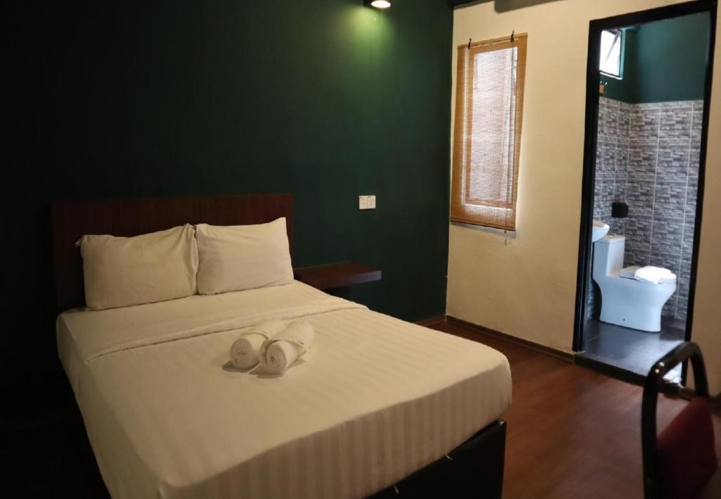 Postel nebo postele na pokoji v ubytování Room V Kluang Parade By SECOM