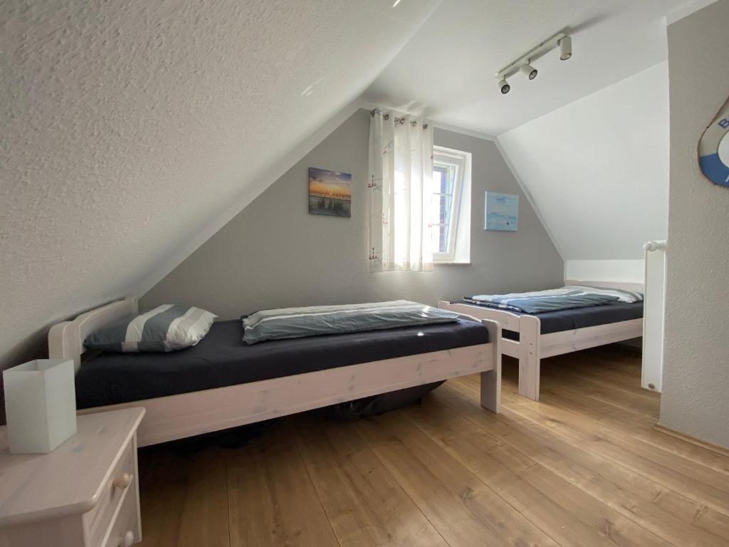 Postel nebo postele na pokoji v ubytování Friesendrööm