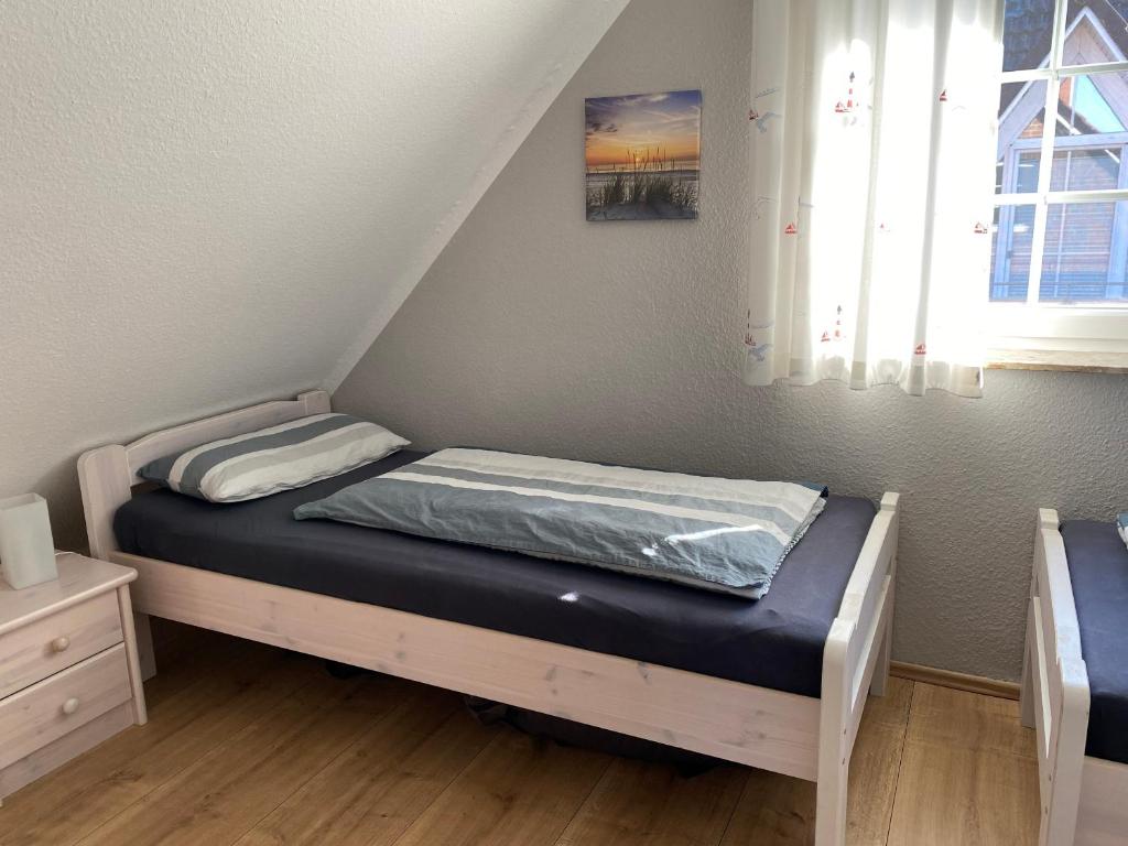 Postel nebo postele na pokoji v ubytování Friesendrööm