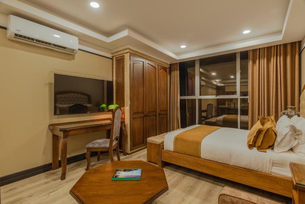 Postel nebo postele na pokoji v ubytování Hotel Du Parc