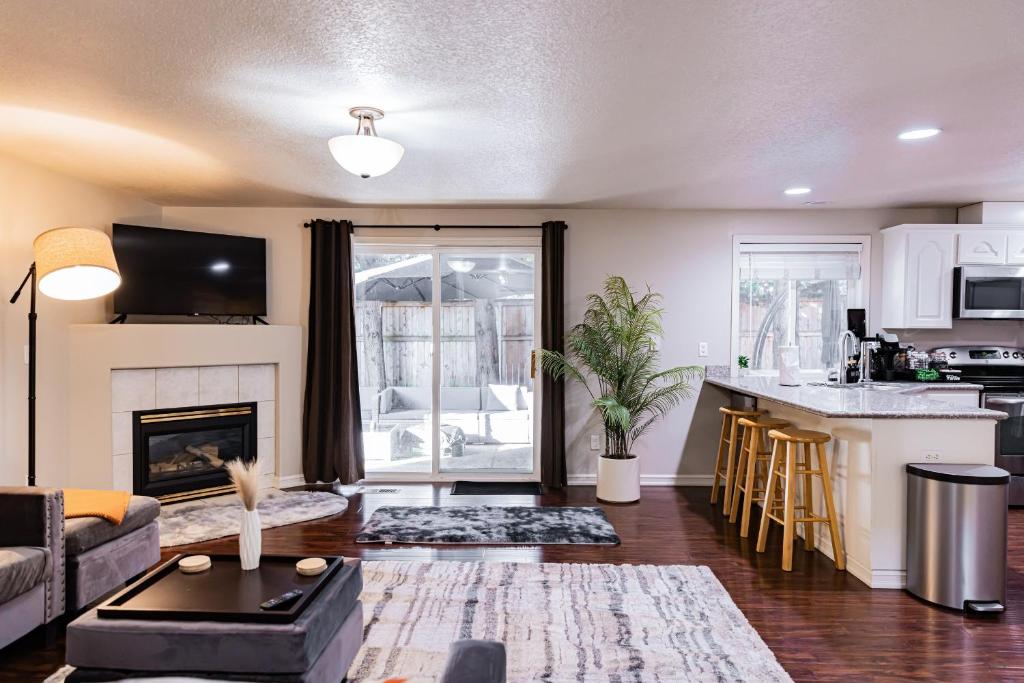 a living room with a couch and a fireplace at Cozy Family Home with Hot Tub and Workspace Near Portland in Vancouver
