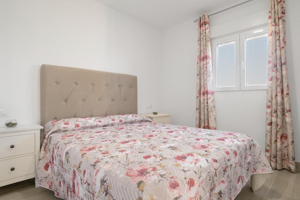 Postel nebo postele na pokoji v ubytování Villa de Gomar