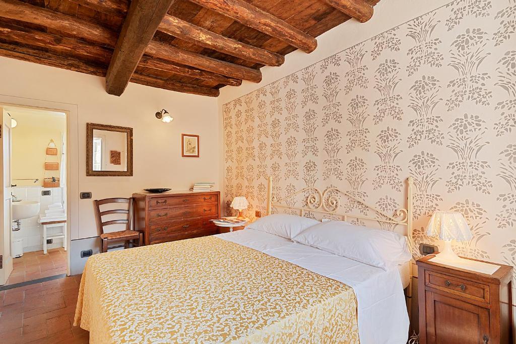 Postel nebo postele na pokoji v ubytování Corte Paganini Casa Vacanze