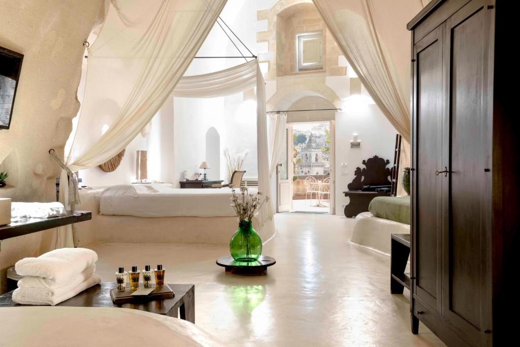 Postel nebo postele na pokoji v ubytování Sant'Angelo, Matera - Small Luxury Hotels