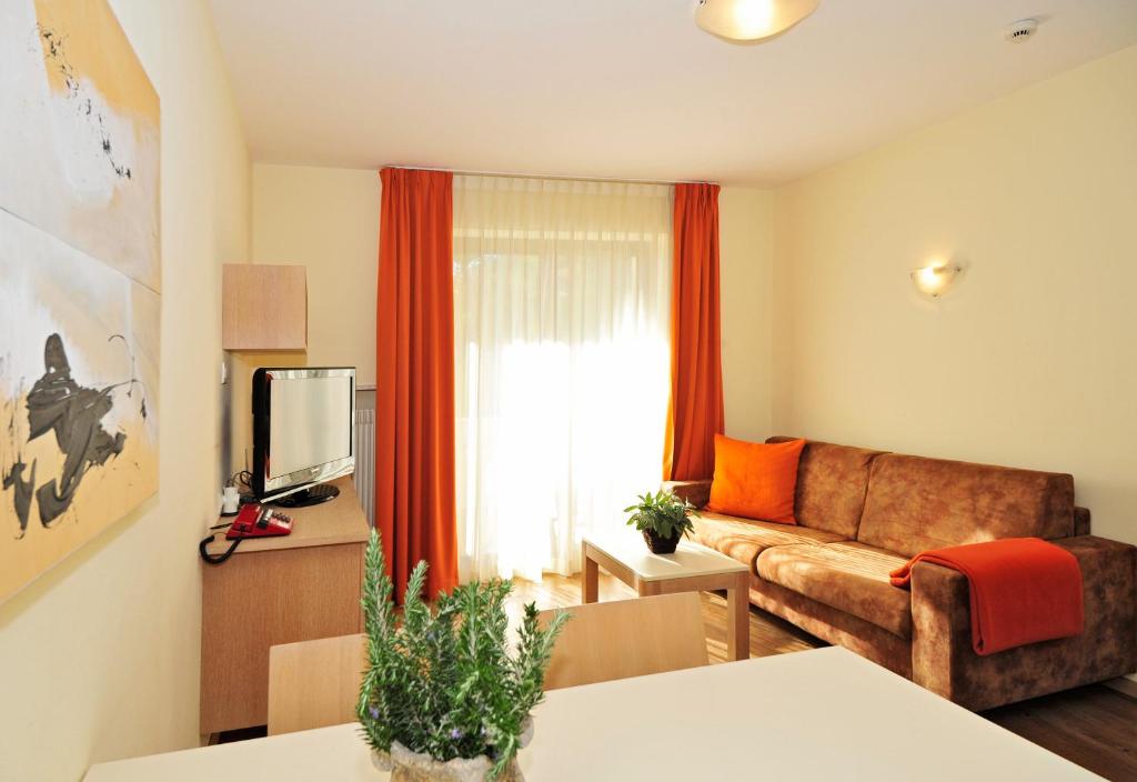 TV a/nebo společenská místnost v ubytování Residence Mignon