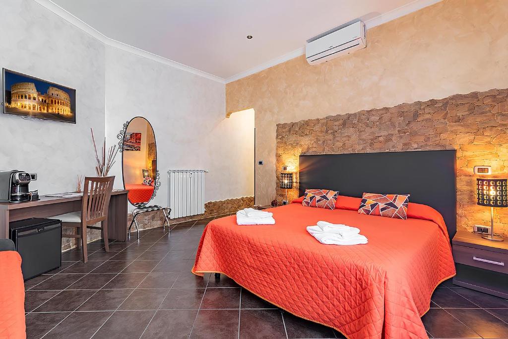 Alis Laura guest house - 150m from piazza bologna metro and 10 minutes from the Colosseum tesisinde bir odada yatak veya yataklar