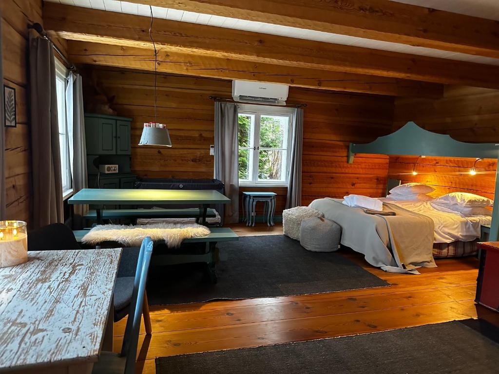 a room with a ping pong table in a cabin at Cottage with sauna, in the heart of the Tammisaari in Tammisaari