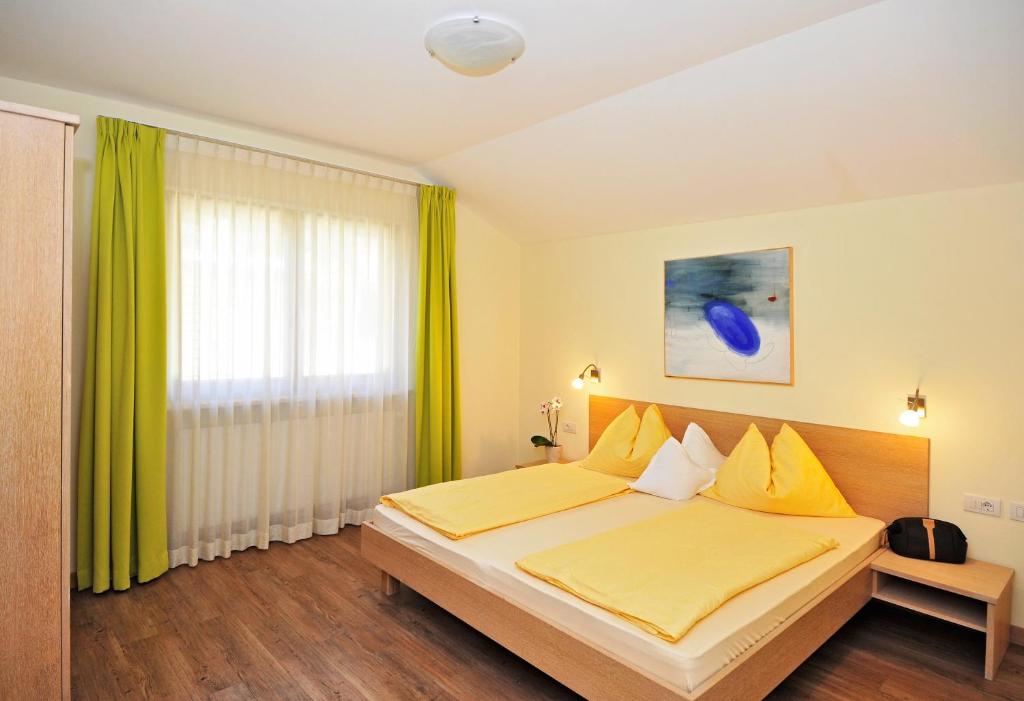 Postel nebo postele na pokoji v ubytování Residence Mignon