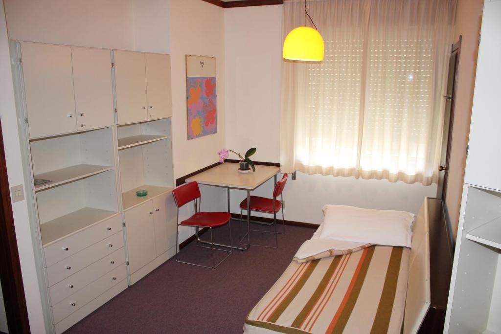 Postel nebo postele na pokoji v ubytování Albergo Residence Italia Vintage Hotel