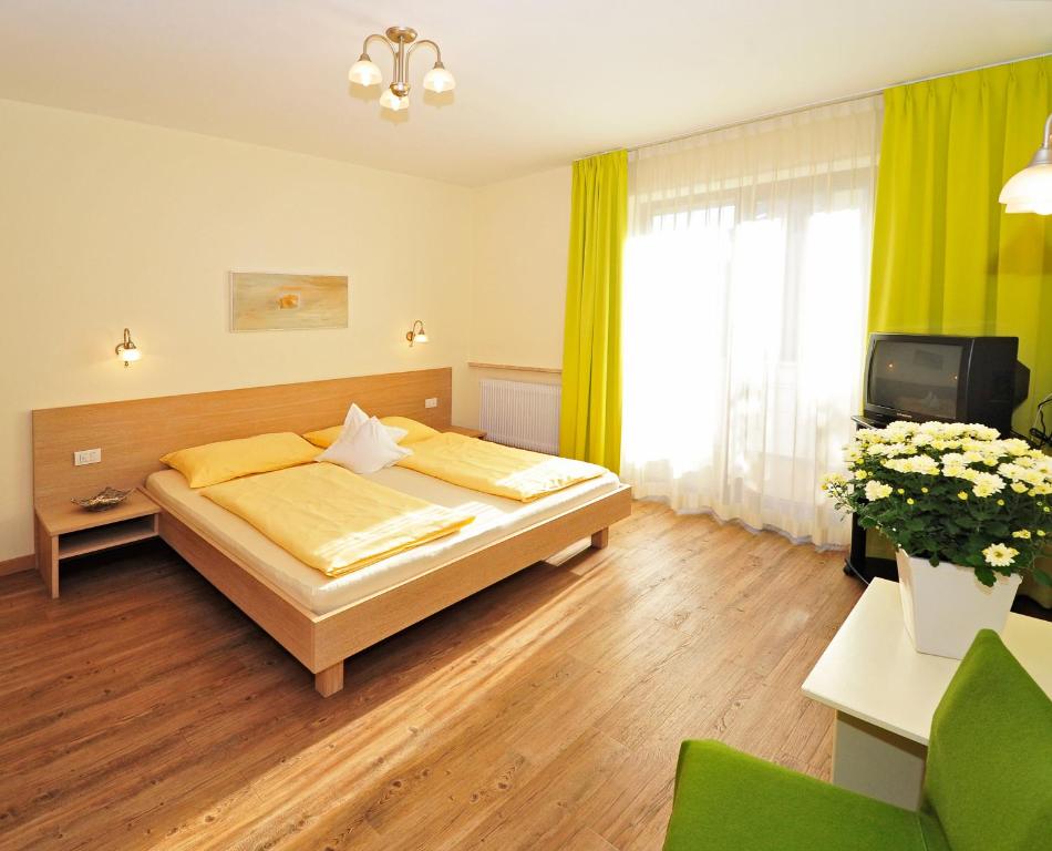 Postel nebo postele na pokoji v ubytování Residence Mignon