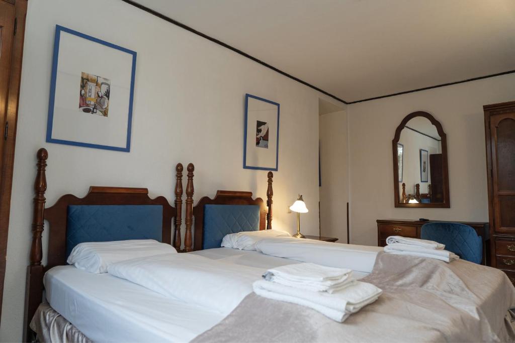 Postel nebo postele na pokoji v ubytování Hotel Petit Wannsee