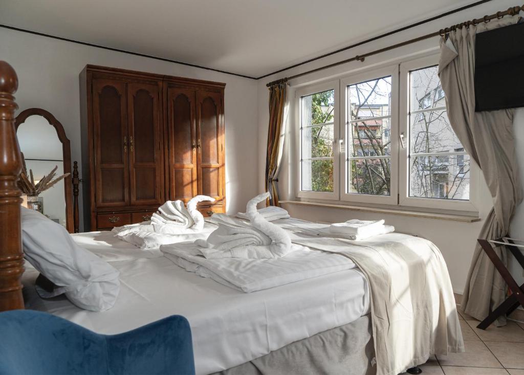 Postel nebo postele na pokoji v ubytování Hotel Petit Wannsee