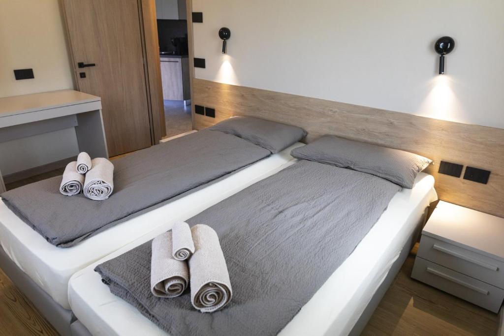 En eller flere senge i et værelse på Baita della Valle - Appartamento Stella Alpina