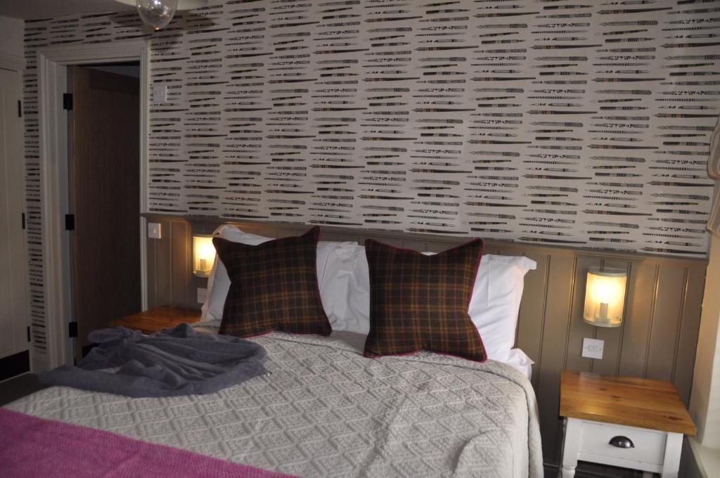 Postel nebo postele na pokoji v ubytování Higher Buck Inn