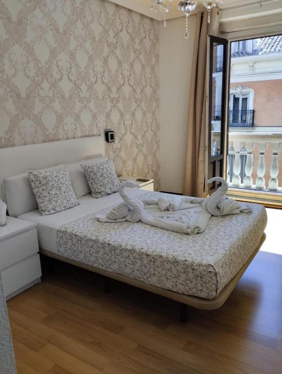 Postel nebo postele na pokoji v ubytování Hostal New Dream Madrid