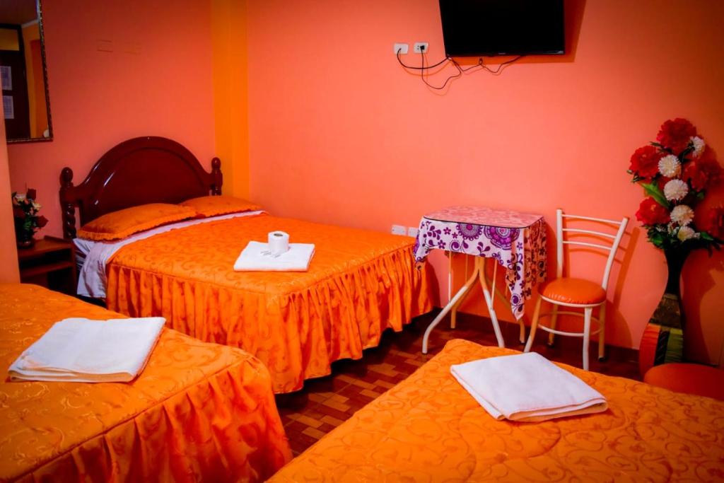 Postel nebo postele na pokoji v ubytování Hospedaje San Pedro Tacna