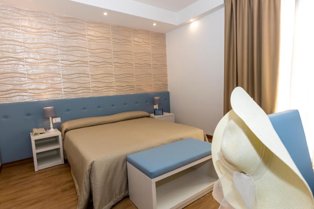 Postel nebo postele na pokoji v ubytování Hotel Touring