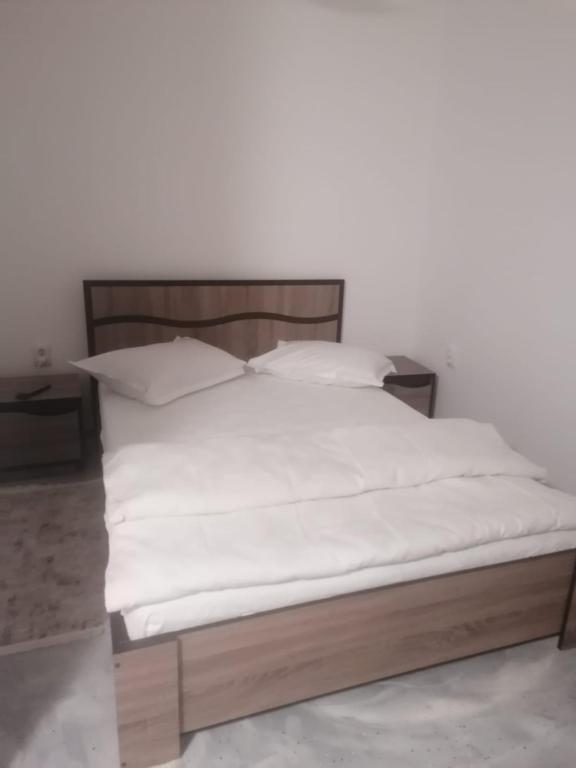 Postel nebo postele na pokoji v ubytování Casa Muresan