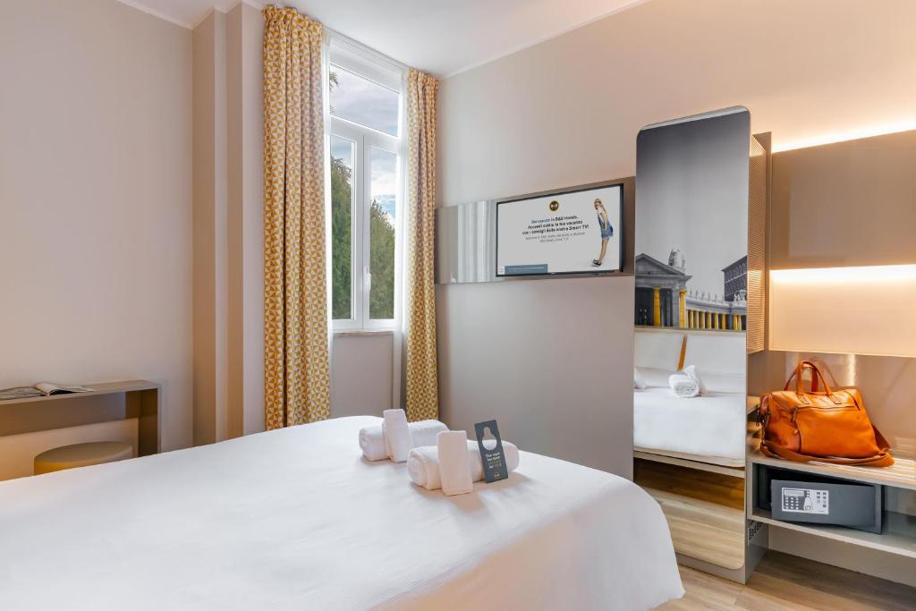 Postel nebo postele na pokoji v ubytování B&B Hotel Roma Pietralata Tiburtina