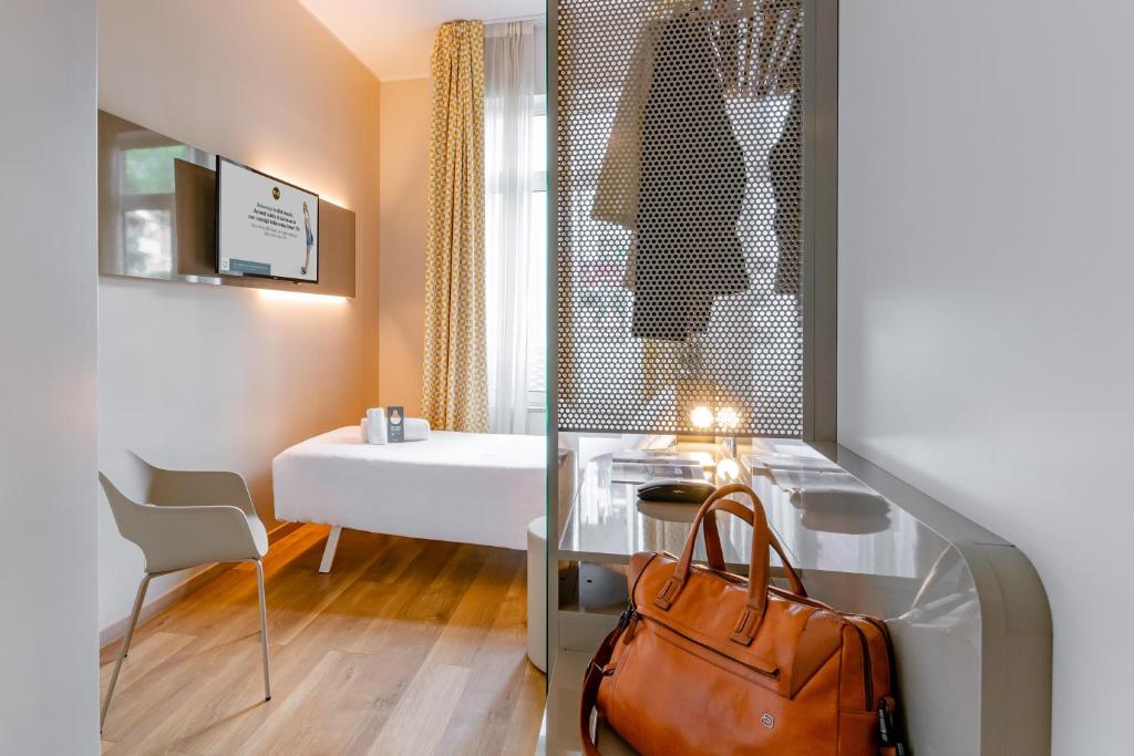 Postel nebo postele na pokoji v ubytování B&B Hotel Roma Pietralata Tiburtina