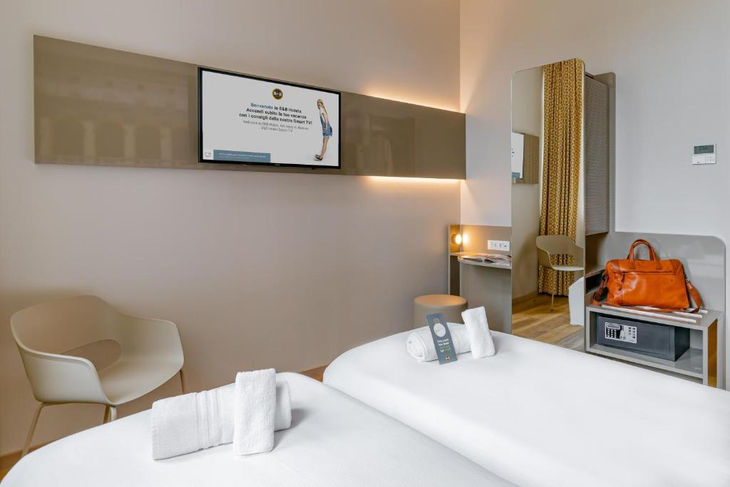 Postel nebo postele na pokoji v ubytování B&B Hotel Roma Pietralata Tiburtina