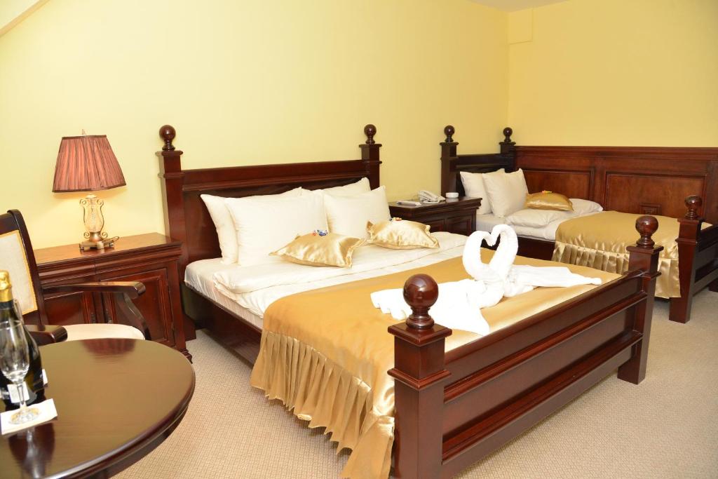 Postel nebo postele na pokoji v ubytování Hotel Zlatarski Zlatnik