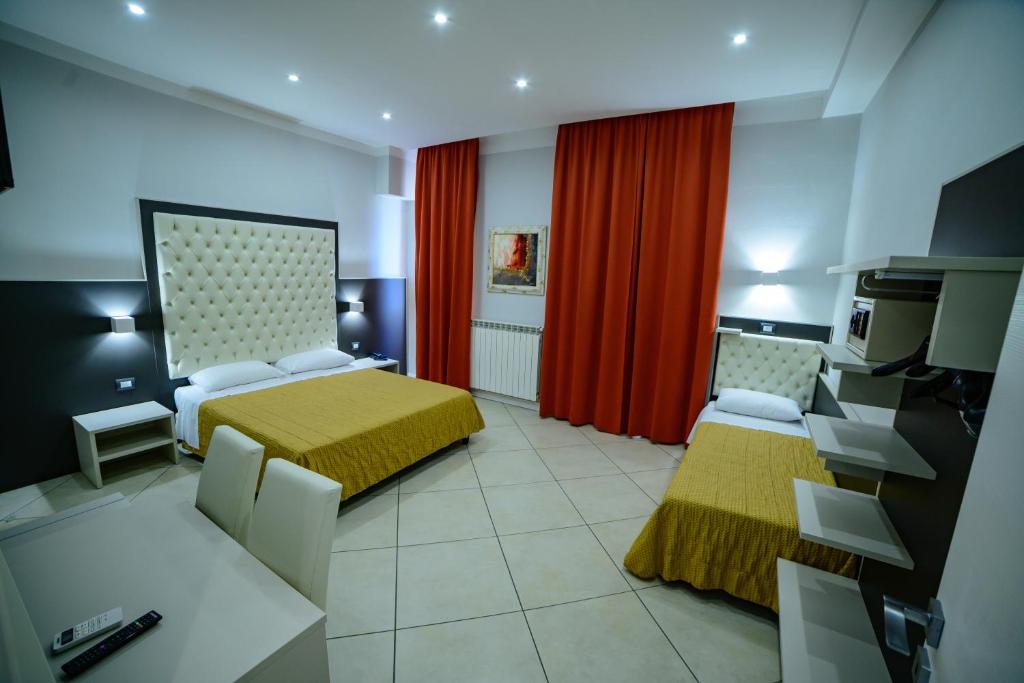 Postel nebo postele na pokoji v ubytování Hotel Demo'