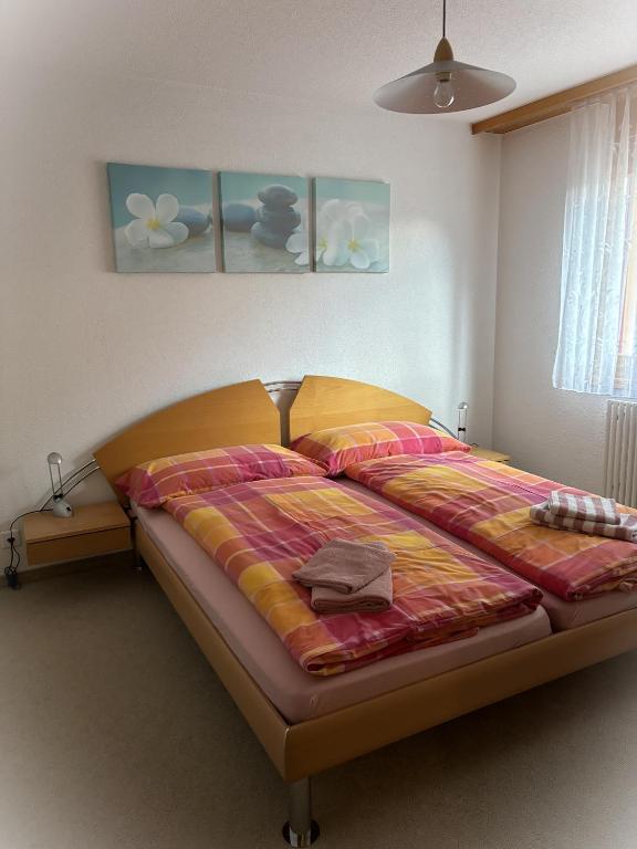 Postel nebo postele na pokoji v ubytování Residenz Darianne Leukerbad