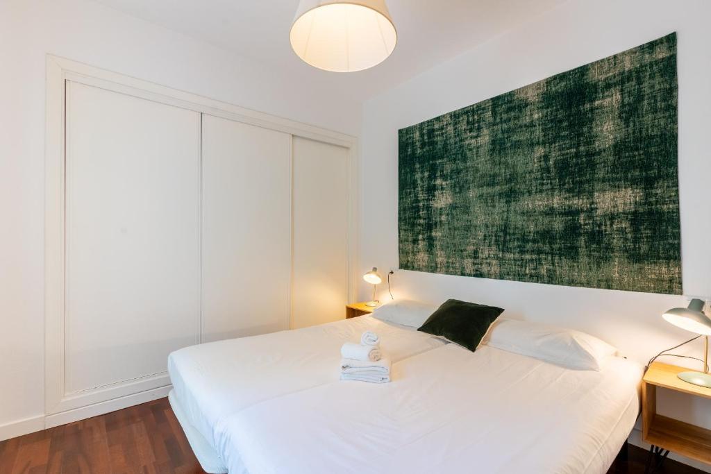 Posteľ alebo postele v izbe v ubytovaní Veoapartment Alhóndiga Segundo