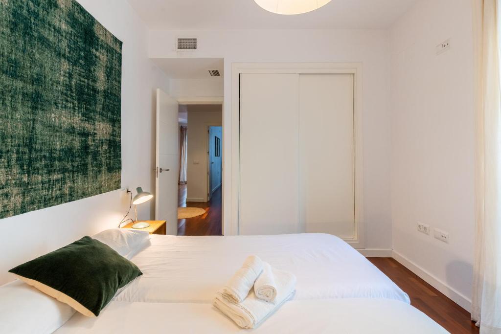 Posteľ alebo postele v izbe v ubytovaní Veoapartment Alhóndiga Segundo