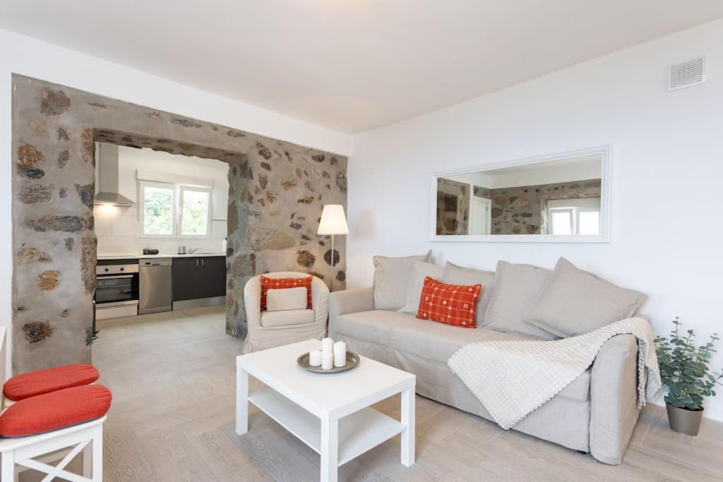 a living room with a couch and a table at Casita Albornoz in Los Realejos