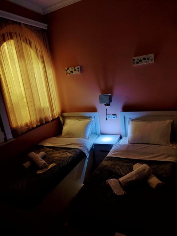 Postel nebo postele na pokoji v ubytování Cozy Rooms Tbilisi