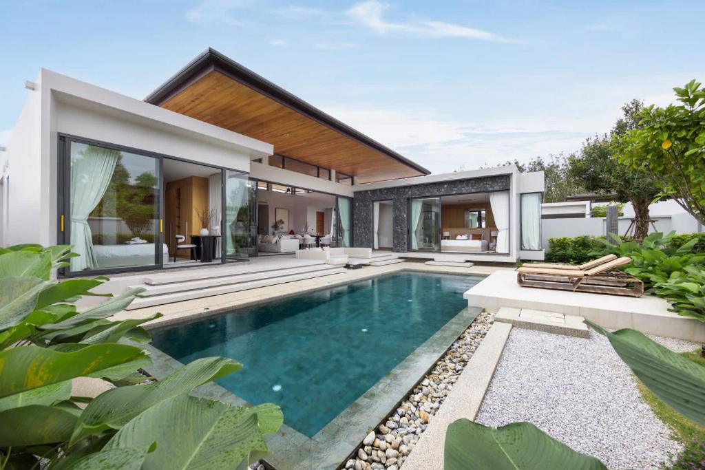 an image of a swimming pool in a house at Luxury 3BR Villa Eden with Private Pool by TropicLook in Ban Pak Lak