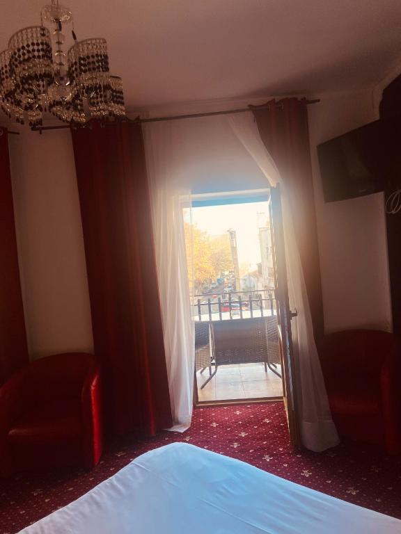 Postel nebo postele na pokoji v ubytování Hotel EvoZava Central