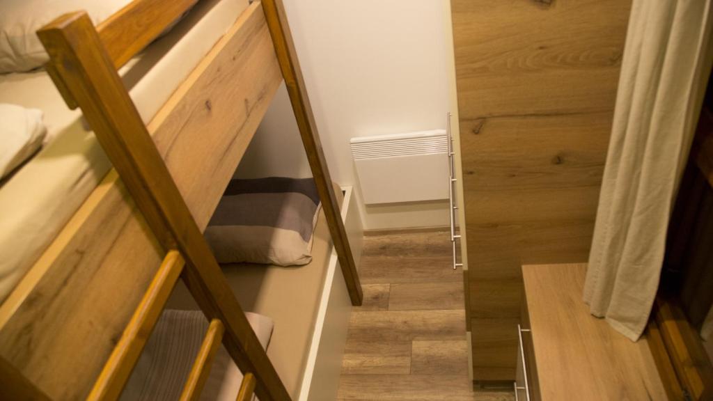 Postel nebo postele na pokoji v ubytování Apartments U Zelmanu