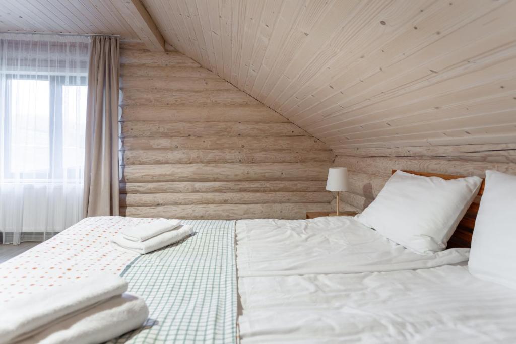 Postel nebo postele na pokoji v ubytování Chalet Borzhava