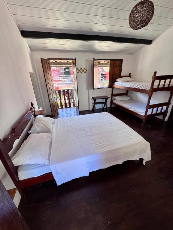 Postel nebo postele na pokoji v ubytování Casa Boa Suites