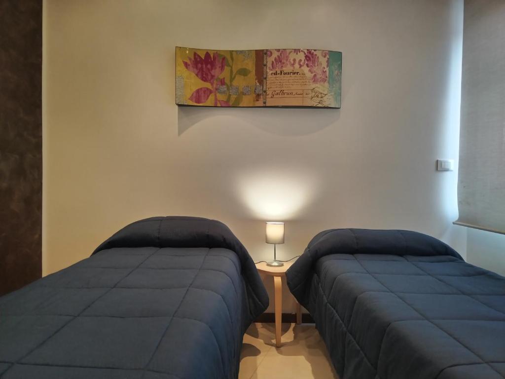 Postel nebo postele na pokoji v ubytování TWIN HOUSE