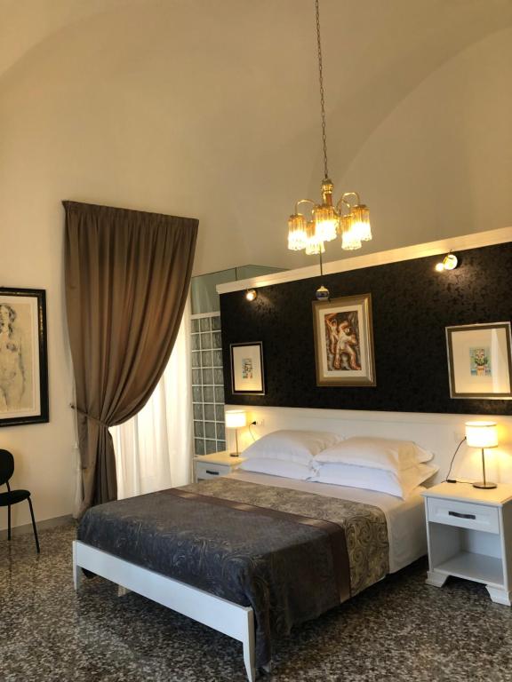 Postel nebo postele na pokoji v ubytování B&B dai Mimmi