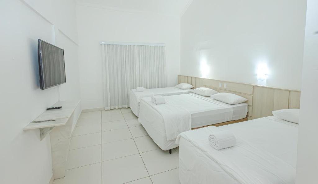 Postel nebo postele na pokoji v ubytování Ramada by Wyndham Porto Seguro Praia