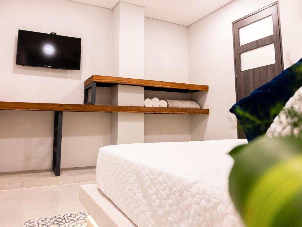 TV a/nebo společenská místnost v ubytování The Garden Suites