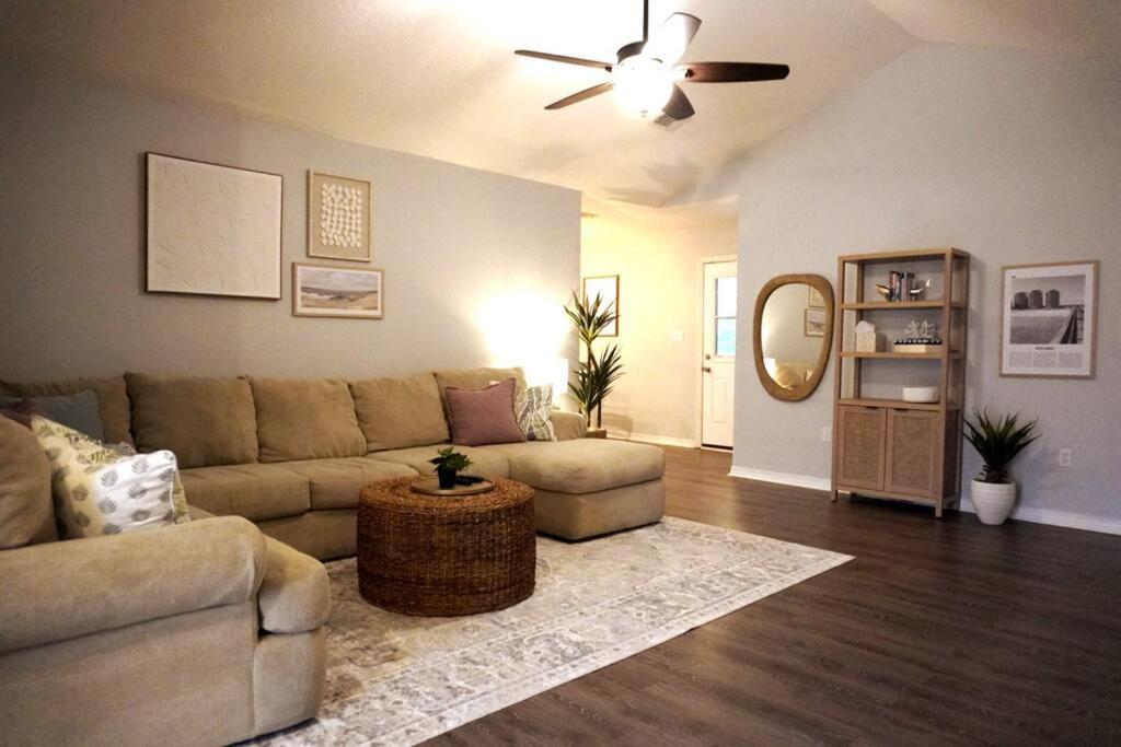 a living room with a couch and a table at 5 Min To Navarre Beach Patio Cute Design Kitchen in Navarre