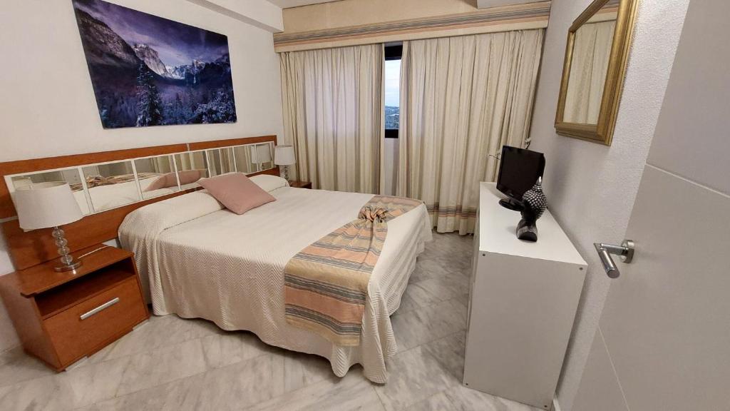 Postel nebo postele na pokoji v ubytování Coblanca 27 - Playa de Poniente