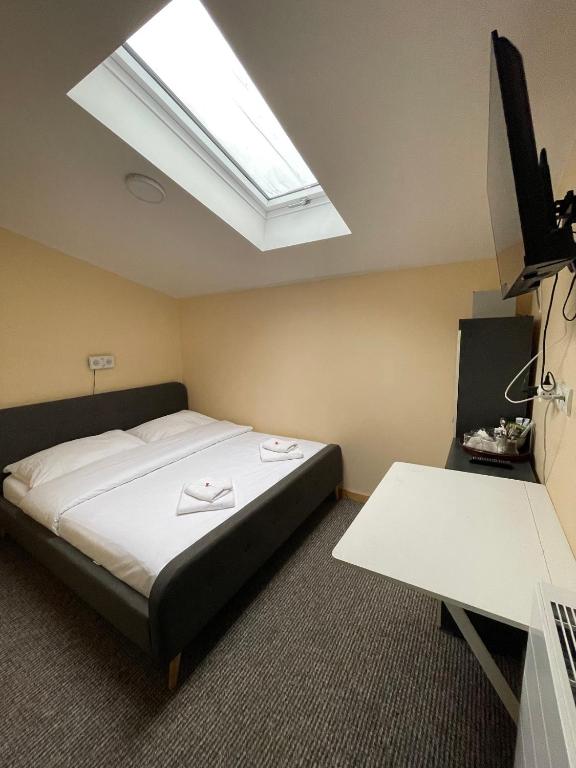 Postel nebo postele na pokoji v ubytování Hotel Jahodnice