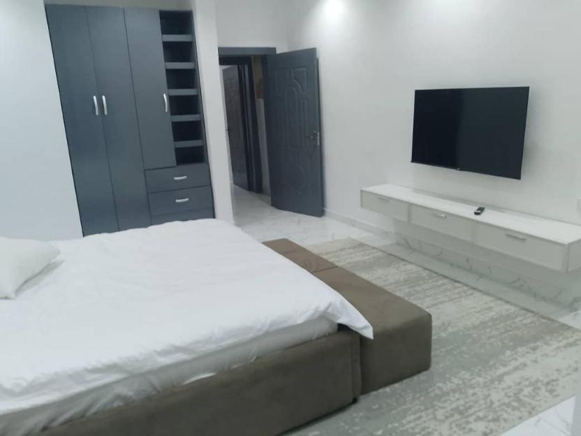 Postel nebo postele na pokoji v ubytování Prince Dikeoha home